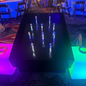Glowing sticks on black table