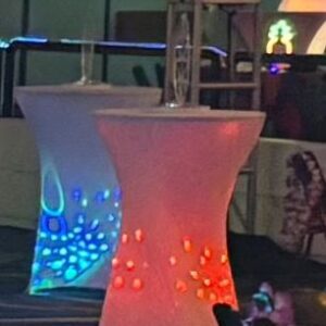Glowing tables with champagne glasses