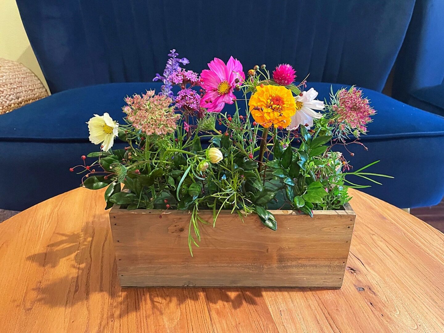 Bright blossoms in rustic planter box