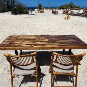 Outdoor dining setup on sandy beach