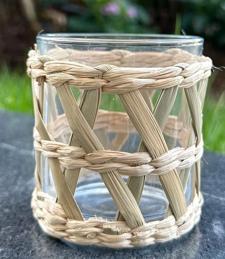 Close-up of decorative rattan-wrapped glass.