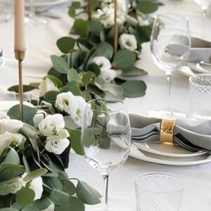 Wedding table decor with candles and greenery