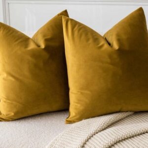 Yellow pillows on a beige couch