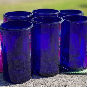 Blue glass cylinders on outdoor table