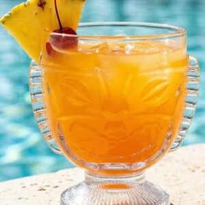 Orange cocktail in decorative glass