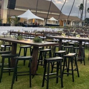 Evening gathering venue with tents and seating