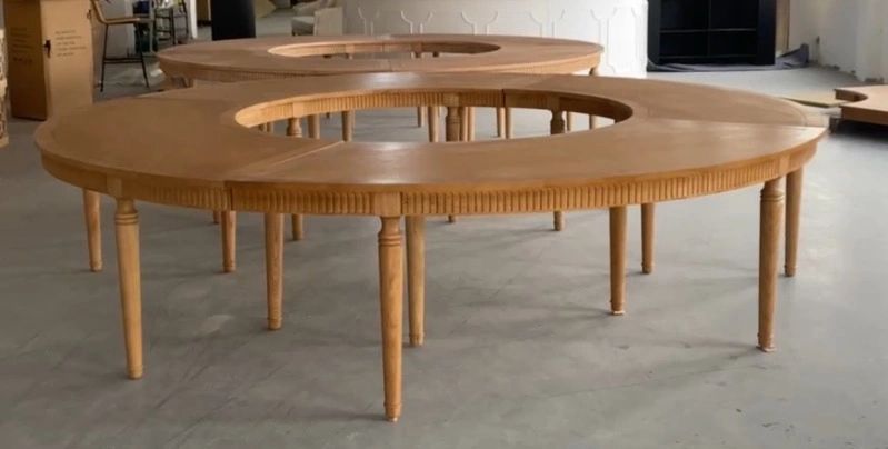 Large ring-shaped wooden tables indoors