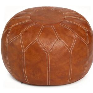 Round leather ottoman with white stitches
