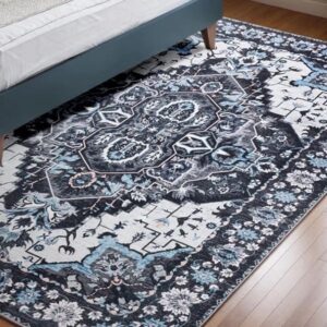 Ornate rug beneath bed in modern bedroom.