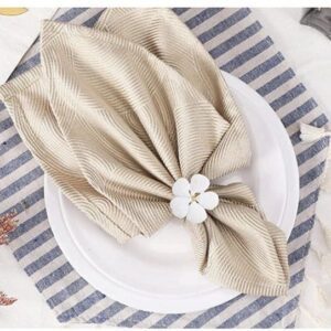 Elegant napkin with floral ring on plate