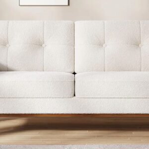 White modern sofa with wooden legs