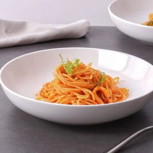 Spaghetti with tomato sauce in white bowl