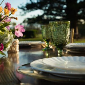 Green glass goblet on set table