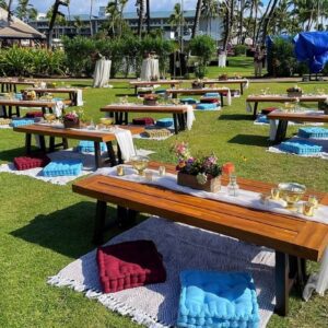 Outdoor picnic setup with wooden tables