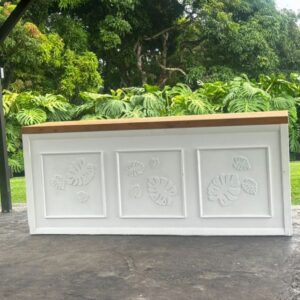 Wooden-topped counter in leafy setting