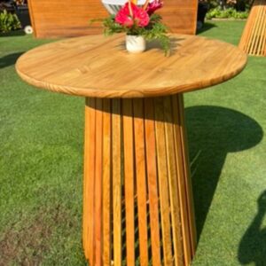 Round table on grass with bouquet