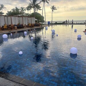 Scenic resort pool with white spheres