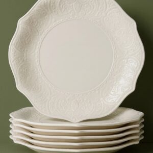 Ornate white dinner plates stack