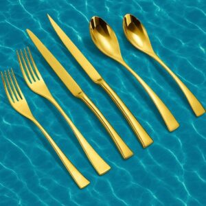 Gold cutlery on blue water background