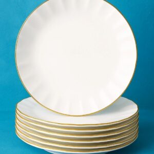 Stack of white plates with gold rims