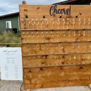 Champagne wall with seating chart