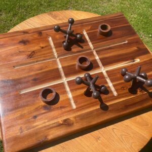 Wooden tic-tac-toe board with pieces