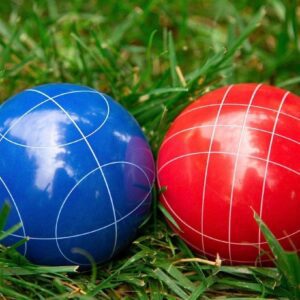 Bocce balls resting in green grass