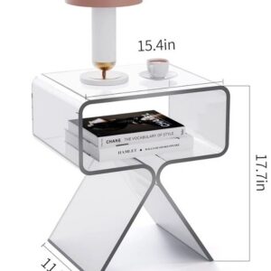 Clear side table with books and lamp